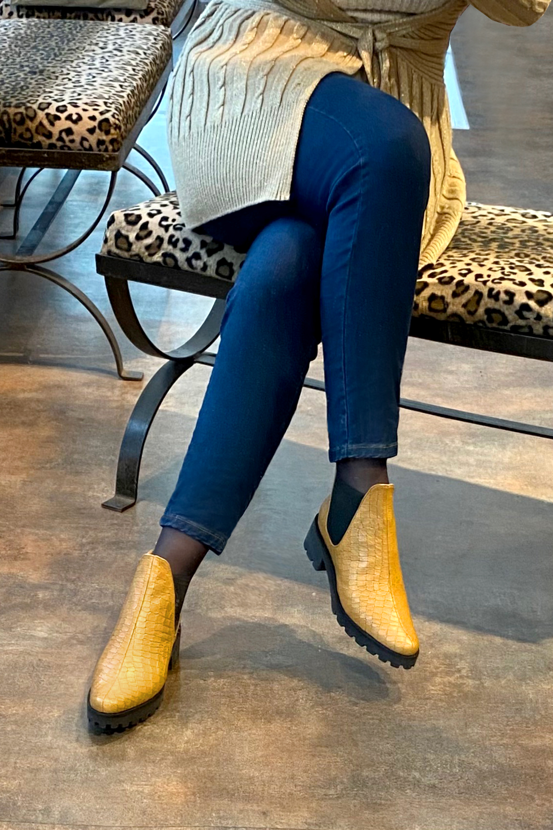 Mustard yellow and matt black women's ankle boots, with elastics. Round toe. Low rubber soles. Worn view - Florence KOOIJMAN
